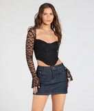 The Current Mood Lace Long Sleeve Corset Top in black brings edge and energy to your vibe, ready to elevate any festival look or concert outfit.