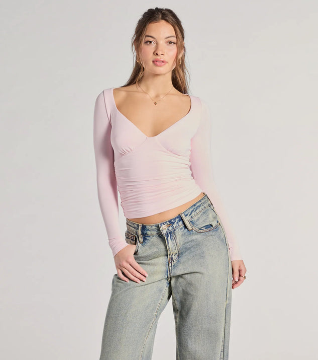The Updated Basic V-Neck Long Sleeve Crop Top in pink with a modern design and trendy look is part of the latest women's tops collection to elevate your 2025 wardrobe.
