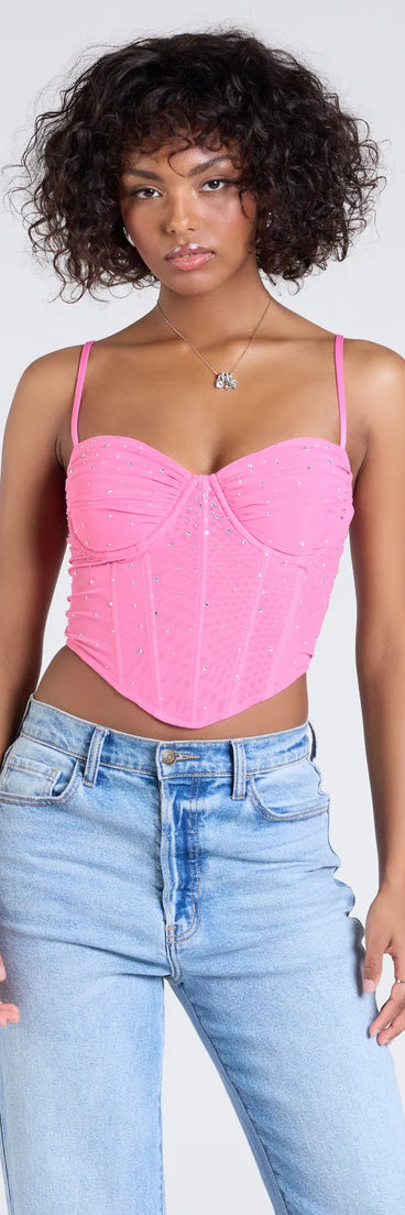 With a structured fit and flattering shape, the Stunned By Luxe Rhinestone Mesh Bustier is a pink bustier that adds a sleek, confident edge to your look.