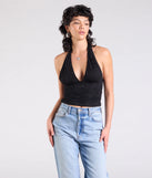 The Alluring Charm Lace Halter Top in black brings edge and energy to your vibe, ready to elevate any festival look or concert outfit.