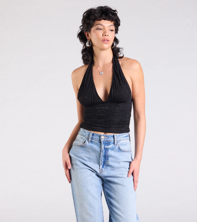 The Alluring Charm Lace Halter Top in black brings edge and energy to your vibe, ready to elevate any festival look or concert outfit.