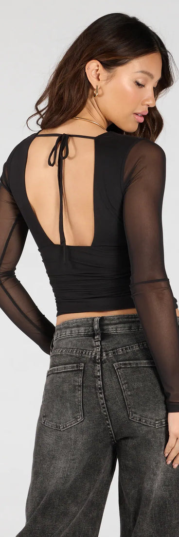 Add a sleek touch to your outfit with this black long sleeve top—the Sassy Style Print Mesh Long Sleeve Top makes effortless transitions from desk to dinner.