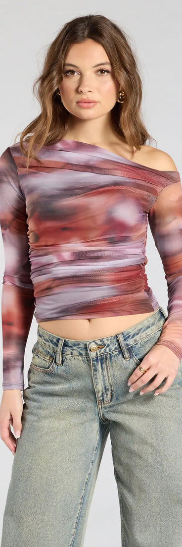 Complete your look with the Wildly Chic Long Sleeve Abstract Print Crop Top, a trendy multi-color top that’s ready to pair with anything in your fall rotation.