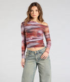 The Wildly Chic Long Sleeve Abstract Print Crop Top in multi-color brings edge and energy to your vibe, ready to elevate any festival look or concert outfit.