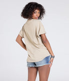 From bold to effortless, the Stay Wild Oversized Graphic Tee lets you define your vibe with taupe tops that speak your style.