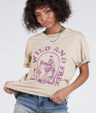 From bold to effortless, the Stay Wild Oversized Graphic Tee lets you define your vibe with taupe tops that speak your style.