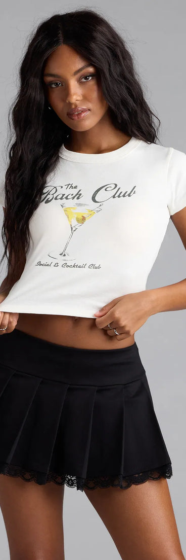 With its midriff cut and trend-forward fit, the The Bach Club Martini Graphic Tee is a white crop top made to pair with skirts, denim, or whatever vibe you're feeling this season.