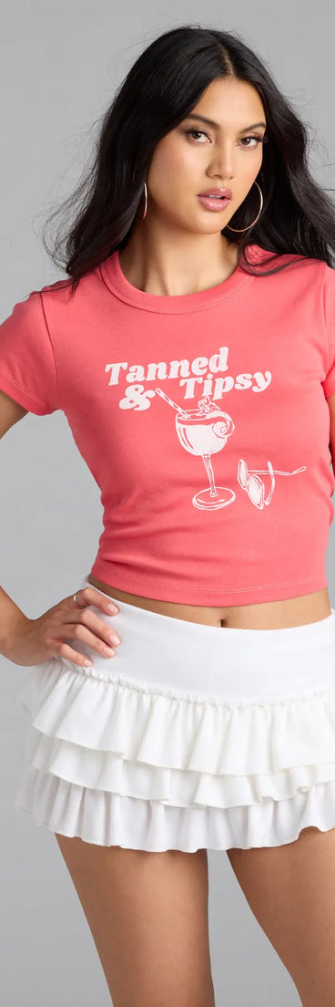 Perfect for layering or wearing solo, this short sleeve top features the Tanned & Tipsy Graphic Tee in red for effortless everyday styling with jeans, cargos, or skirts.