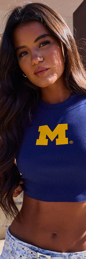 Trendy women’s tops, like the Go Blue® Vibes Michigan® Cropped Tank Top, bring effortless style for fall layering, lounging, or going out.