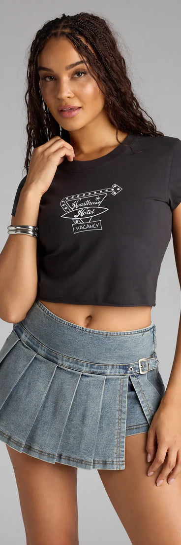 Complete your look with the Heartbreak Hotel Graphic Crop Top, a trendy black top that’s ready to pair with anything in your fall rotation.