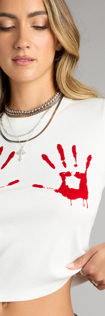 Trendy women’s tops, like the Hands On Graphic Baby Tee, bring effortless style for fall layering, lounging, or going out.