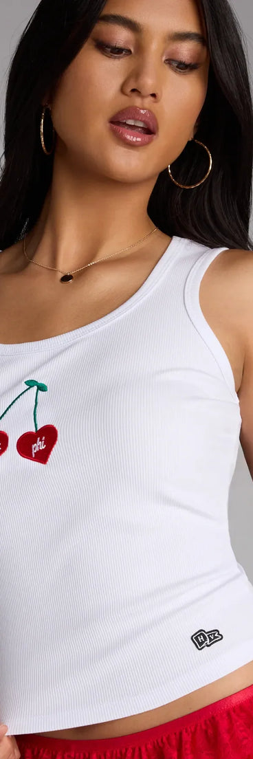 Complete your look with the Too Sweet Alpha Phi Cherry Tank Top, a trendy white top that’s ready to pair with anything in your fall rotation.