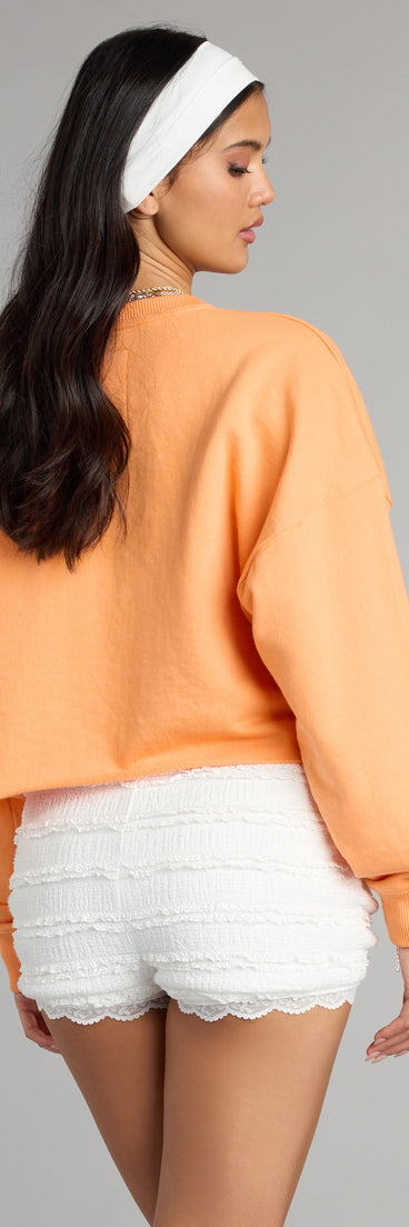 Trendy women’s tops, like the Game Day Glow Up Pullover Top, bring effortless style for fall layering, lounging, or going out.