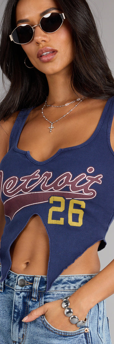 Complete your look with the Street Team Graphic Cutout Crop Tank Top, a trendy top that’s ready to pair with anything in your fall rotation.