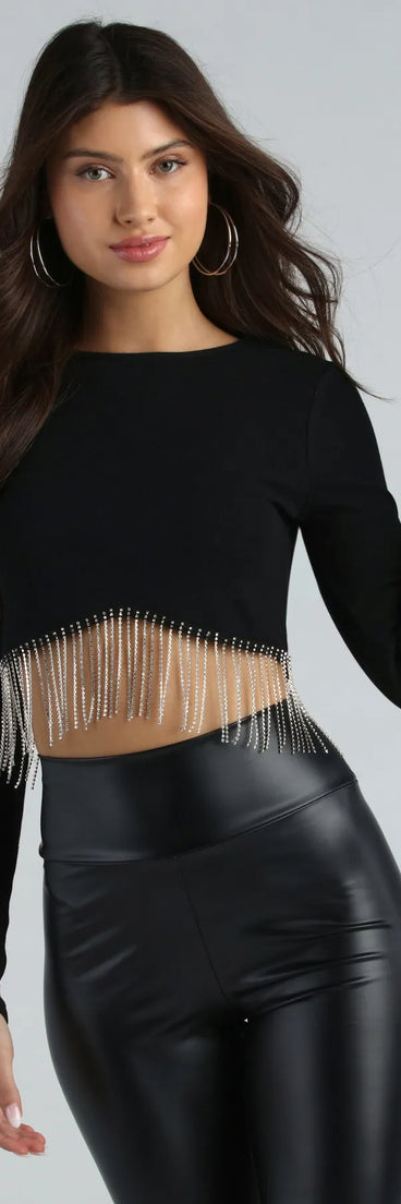 Get ready for any event with the Glam Experince Rhinestone Fringe Crop Top in black, an essential start to creating a versatile holiday outfit for women for holiday parties, cocktail hours, or NYE events.