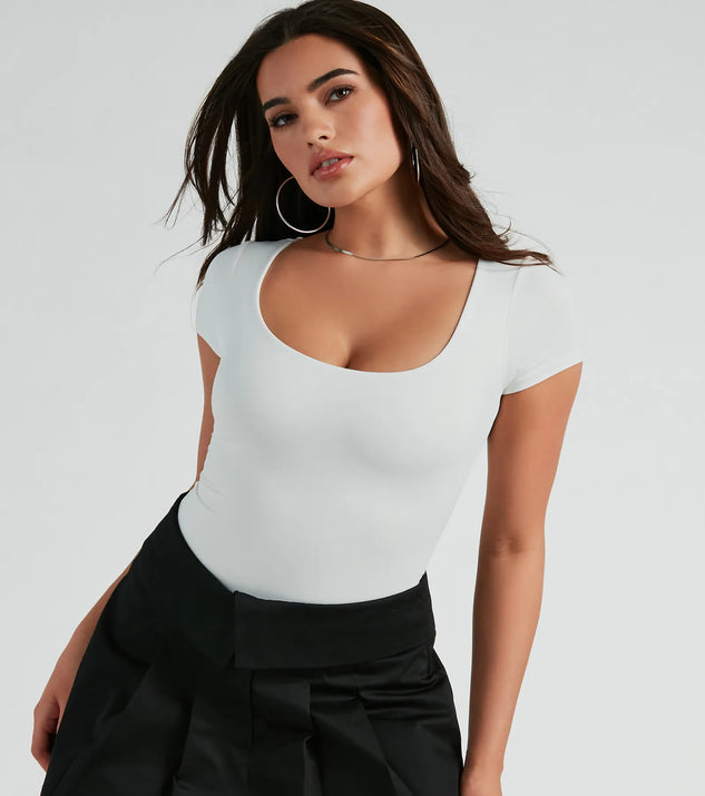 Elevate your winter outfits with the Minimal Chic Ribbed Knit Long Sleeve Bodysuit, a white bodysuit designed for confident and effortless styling with anything from mini skirts to high-waist jeans.