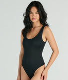 Elevate your winter outfits with the Smooth Silhouette Sleeveless Scoop Neck Bodysuit, a black bodysuit designed for confident and effortless styling with anything from mini skirts to high-waist jeans.