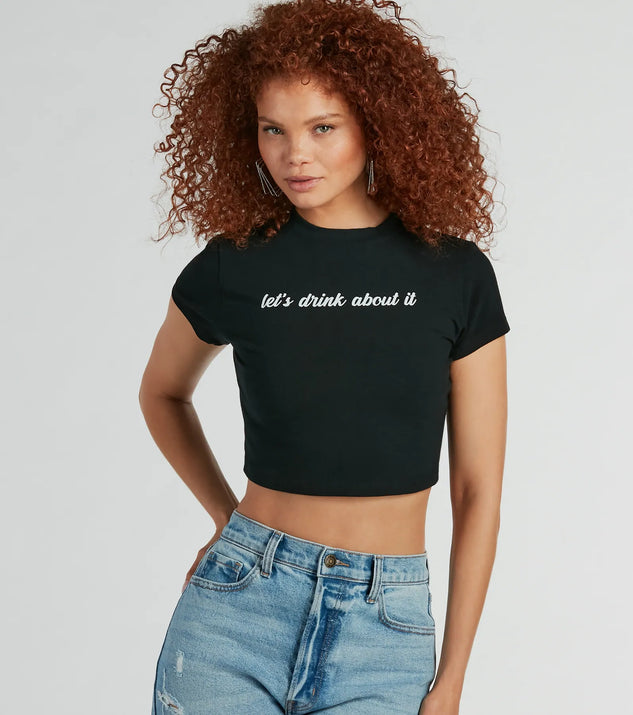 The Let's Drink About It Crop Graphic Tee in black with a modern design and trendy look is part of the latest women's tops collection to elevate your 2025 wardrobe.