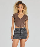 The Girl Next Door Ribbed Knit Henley Crop Top in brown with a modern design and trendy look is part of the latest women's tops collection to elevate your 2025 wardrobe.