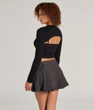 The Snuggle Worthy Ribbed Knit Long Sleeve Top is a women's black long-sleeve top with an elevated style and unique design accents, perfect for layering or transitioning into colder months.