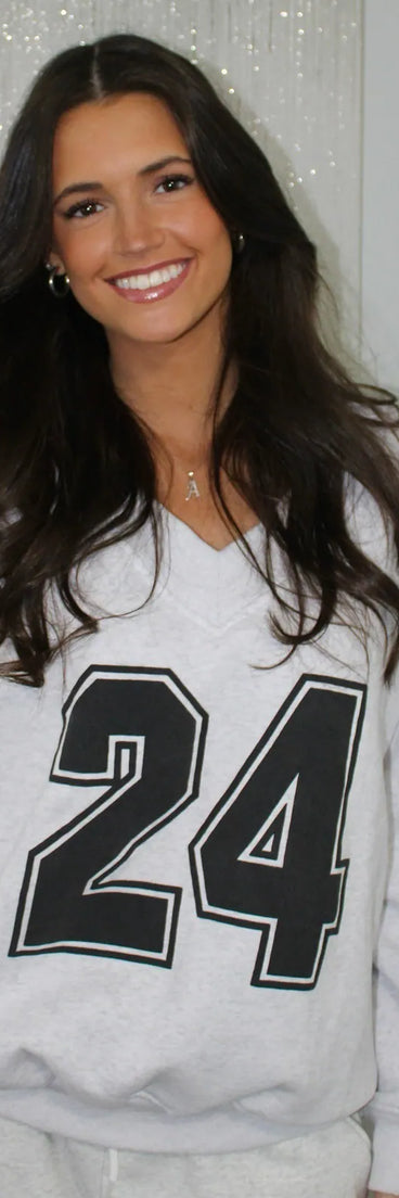 The 24 Graphic Oversized Pullover Sweatshirt in gray with a modern design and trendy look is part of the latest women's tops collection to elevate your 2025 wardrobe.