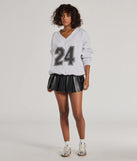 Layer-friendly 24 Graphic Oversized Pullover Sweatshirt is a chic, transitional gray long-sleeve top with contemporary sleeves and neckline design, ideal for an elevated cozy style or casual elegance.
