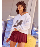Layer-friendly 24 Graphic Oversized Pullover Sweatshirt is a chic, transitional gray long-sleeve top with contemporary sleeves and neckline design, ideal for an elevated cozy style or casual elegance.