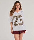 The 23 Leopard Print Oversized Graphic Tee in white with a modern design and trendy look is part of the latest women's tops collection to elevate your 2025 wardrobe.