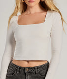 Stand out in 2025 in the Back To Basics Cropped Long Sleeve Top, a women's ivory long-sleeve top crafted from an elevated fabric with a modern neckline perfect for party outfits, bridal shower attire, or elevated casual outfits.