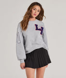 The LA Graphic Fleece Sweatshirt in gray with a modern design and trendy look is part of the latest women's tops collection to elevate your 2025 wardrobe.