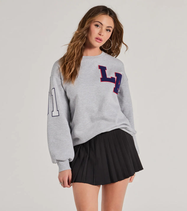 The LA Graphic Fleece Sweatshirt in gray with a modern design and trendy look is part of the latest women's tops collection to elevate your 2025 wardrobe.