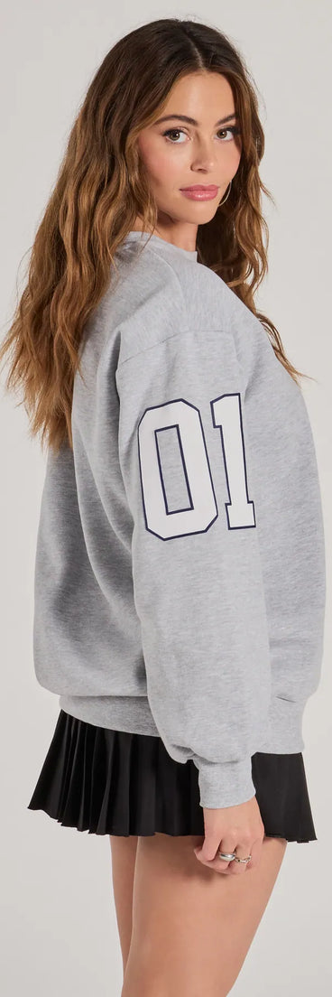 Layer-friendly LA Graphic Fleece Sweatshirt is a chic, transitional gray long-sleeve top with contemporary sleeves and neckline design, ideal for an elevated cozy style or casual elegance.