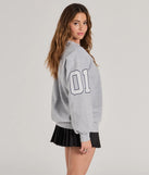 Layer-friendly LA Graphic Fleece Sweatshirt is a chic, transitional gray long-sleeve top with contemporary sleeves and neckline design, ideal for an elevated cozy style or casual elegance.