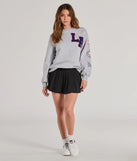 Layer-friendly LA Graphic Fleece Sweatshirt is a chic, transitional gray long-sleeve top with contemporary sleeves and neckline design, ideal for an elevated cozy style or casual elegance.