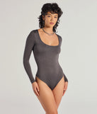 Elevate your seasonal style with the Smooth Silhouette Sleeveless Scoop Neck Bodysuit, a charcoal bodysuit designed for confident and effortless styling with anything from mini skirts to high-waist jeans.