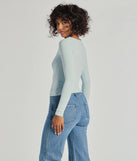 The Forever Staple Smooth Knit Long Sleeve Top is a women's light blue long-sleeve top with an elevated style and unique design accents, perfect for layering or transitioning into colder months.