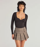 The Minimal Chic Ribbed Knit Long Sleeve Bodysuit in black with a modern design and trendy look is part of the latest women's tops collection to elevate your 2025 wardrobe.