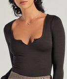 Elevate your seasonal style with the Minimal Chic Ribbed Knit Long Sleeve Bodysuit, a black bodysuit designed for confident and effortless styling with anything from mini skirts to high-waist jeans.