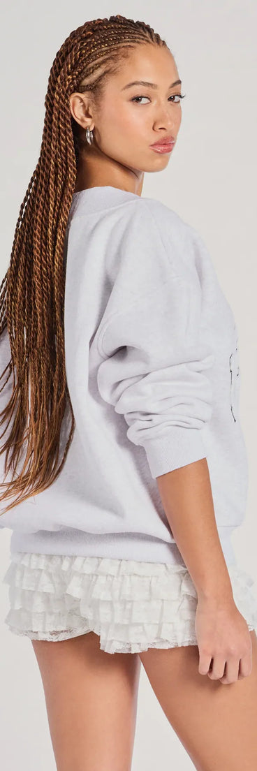 Add a sleek touch to your outfit with this gray long sleeve top—the New York V-Neck Fleece Oversized Sweatshirt makes effortless transitions from desk to dinner.