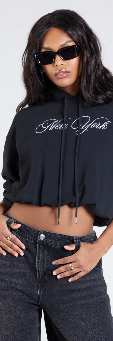 The New York Bubble Crop Hoodie in black brings edge and energy to your vibe, ready to elevate any festival look or concert outfit.