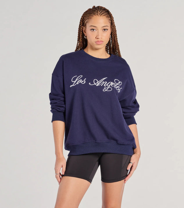 The Los Angeles Embroidered Oversized Sweatshirt in navy blue with a modern design and trendy look is part of the latest women's tops collection to elevate your 2025 wardrobe.