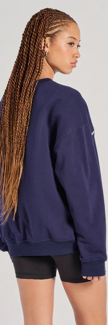 The Los Angeles Embroidered Oversized Sweatshirt in navy blue with a modern design and trendy look is part of the latest women's tops collection to elevate your 2025 wardrobe.