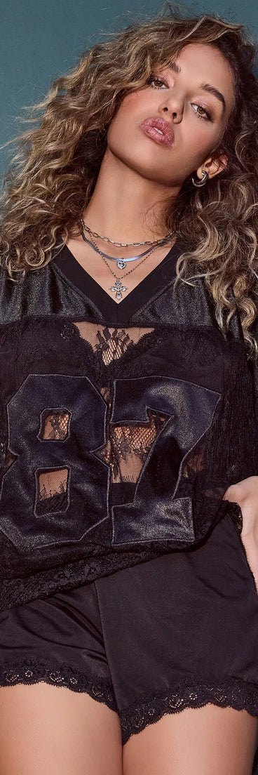 The Sporty Chic Lace V-Neck 87 Graphic Jersey Top in black with a modern design and trendy look is part of the latest women's tops collection to elevate your 2025 wardrobe.