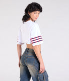 From bold to effortless, the Go Team Varsity Graphic Crop Tee lets you define your vibe with white tops that speak your style.