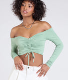 Stay on-trend this season with the Sultry Perception Off-The-Shoulder Crop Top in sage green, a must-have for creating stylish and effortless spring outfits for women.