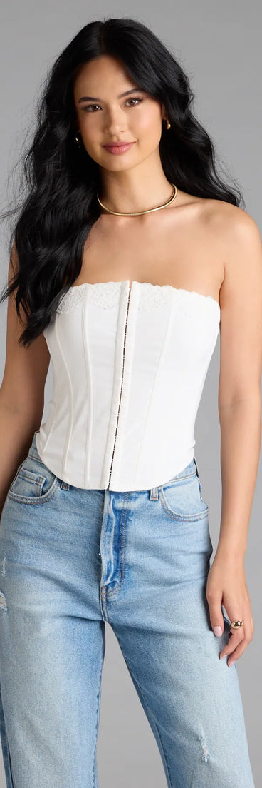 With its midriff cut and trend-forward fit, the Chic And Snatched Strapless Lace Trim Corset Top is a white crop top made to pair with skirts, denim, or whatever vibe you're feeling this season.