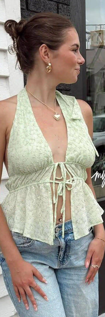 For college campus looks, game day outfits, or a bold going-out vibe, the Cute Adventures Halter Tie Front Crop Top is an on-trend green crop top that easily styles with your favorite denim.