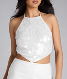 For college campus looks, game day outfits, or a bold going-out vibe, the Prominent Shine Sequin Halter Crop Top is an on-trend white crop top that easily styles with your favorite denim.