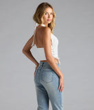 With its midriff cut and trend-forward fit, the The New Classic Halter Lace-Up Denim Corset Top is a white crop top made to pair with skirts, denim, or whatever vibe you're feeling this season.
