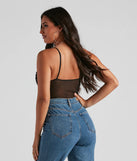 Flaunt your silhouette with the Twisted Angel Embroidered Bodysuit, a chic black bodysuit crafted for sleek looks. Whether you're dressing up for parties or just want to stop their scroll, this fitted design adds modern flair to any outfit.